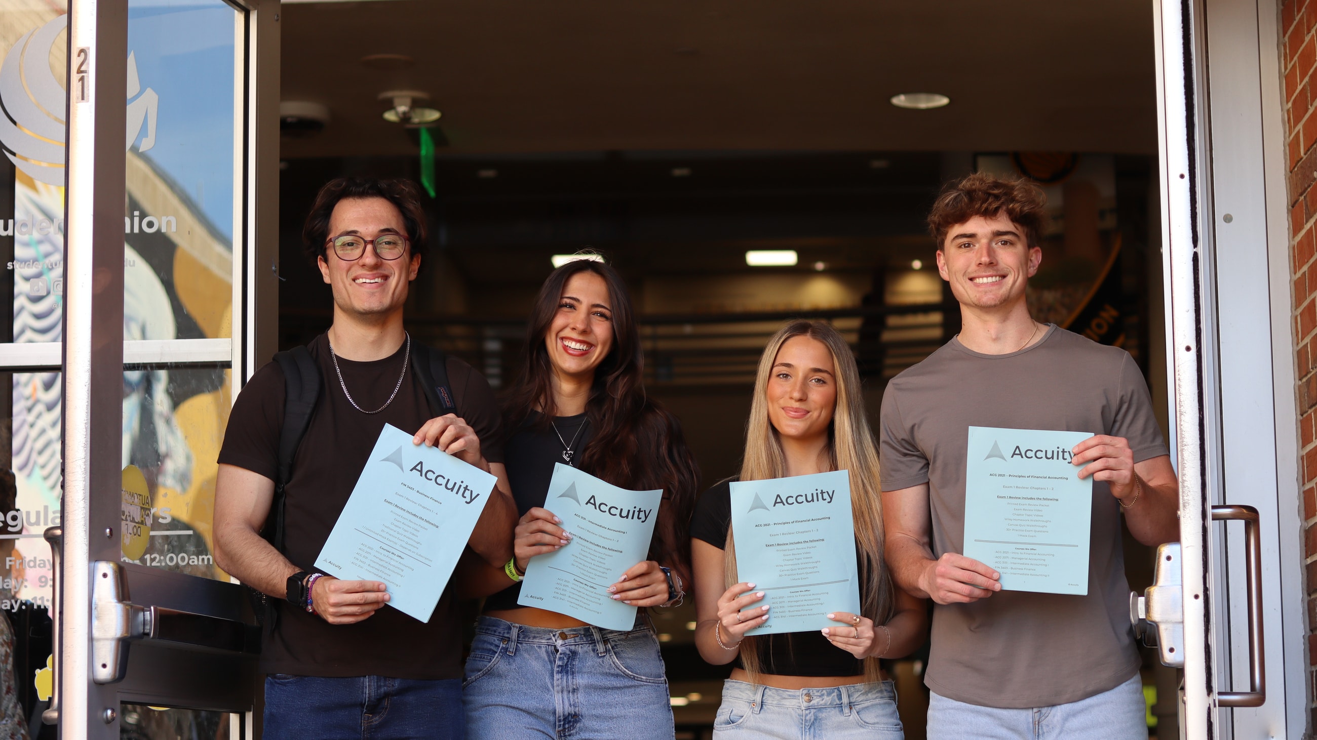 UCF students with Accuity study packets on campus